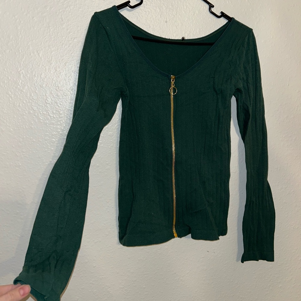 Small zip up jacket. Stretchy. Idk brand